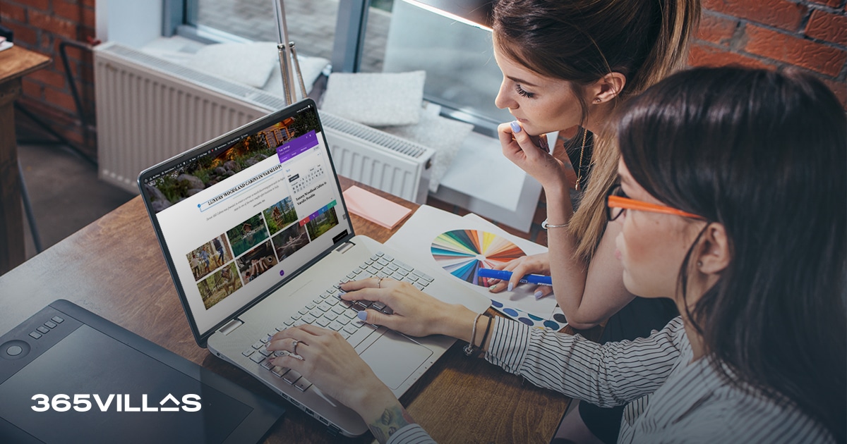 Two women sitting at a computer, enthusiastically planning their upcoming getaway on a website using a perfect vacation rental template