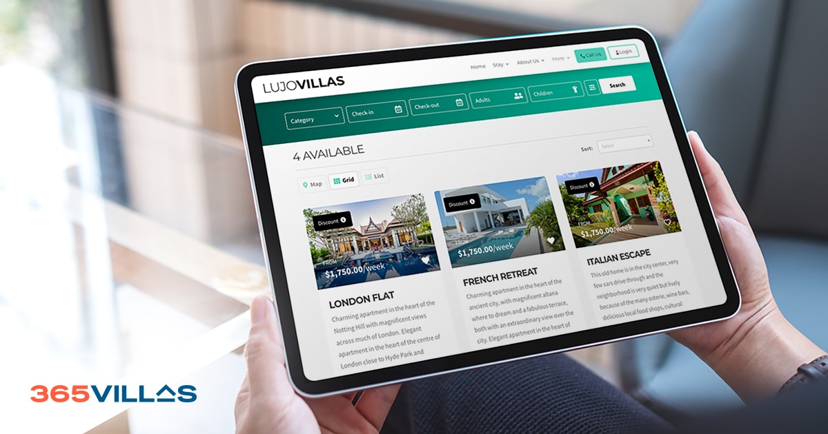A man focused on a tablet screen showcasing an attractive website designed for vacation rental businesses.