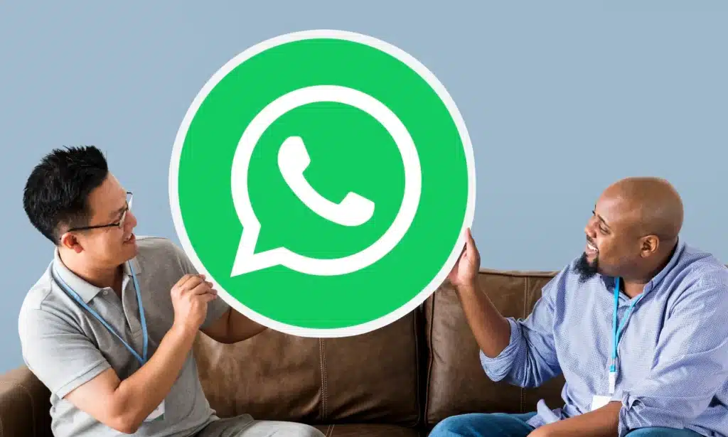 men showing whatsapp logo